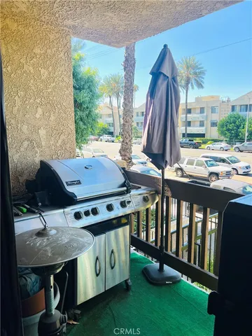 a view of a patio with a table and chairs
