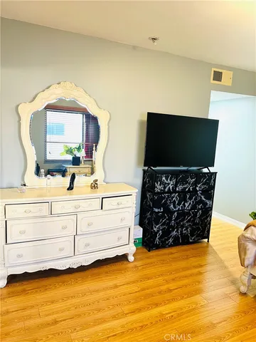 a living room with fireplace furniture and a flat screen tv