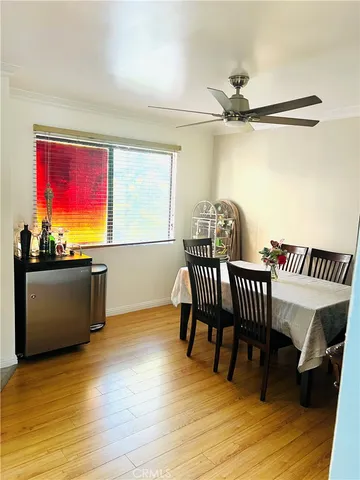 a view of a room with furniture and wooden floor