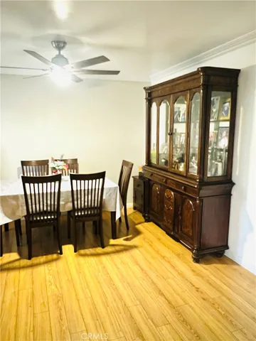 a view of a room with furniture and wooden floor