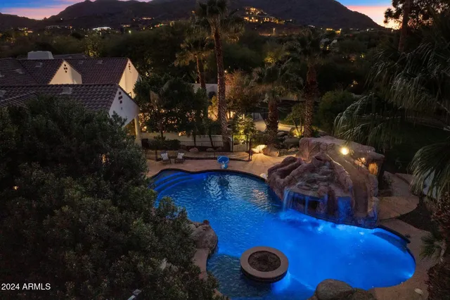 a view of a swimming pool with lounge chair