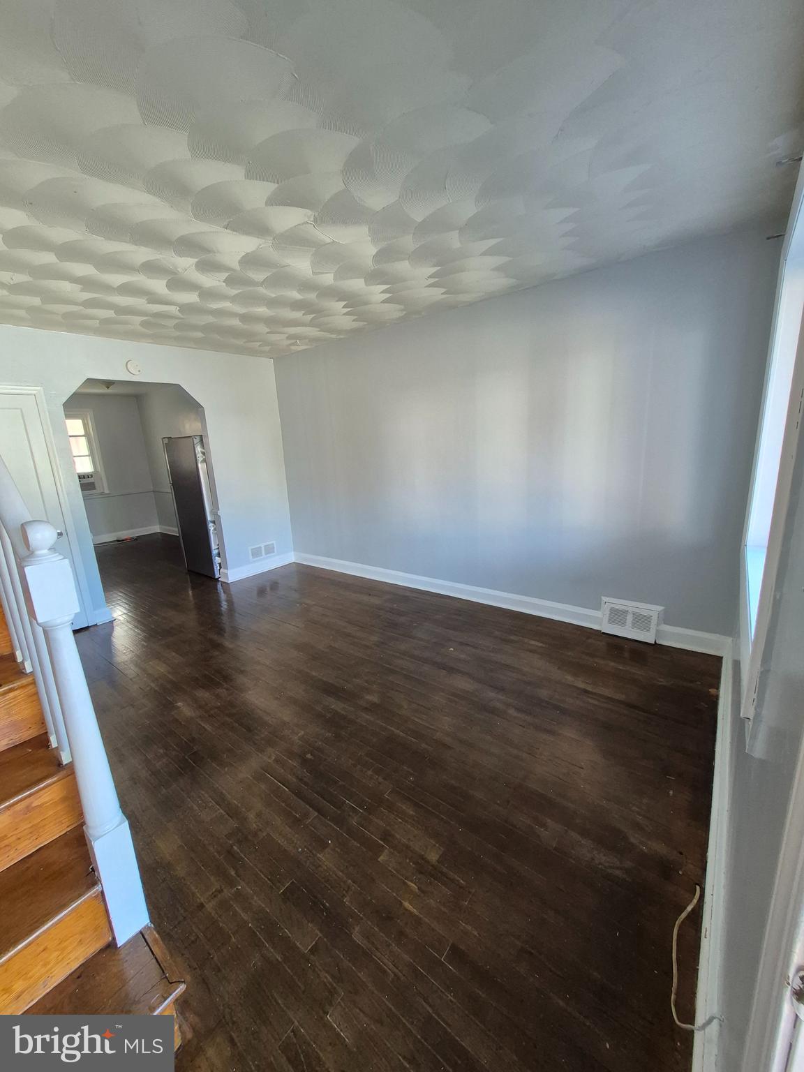 2863 Edgecombe Circle South Baltimore, MD 21215 - Photo 2 of 31 a view of empty room with wooden floor