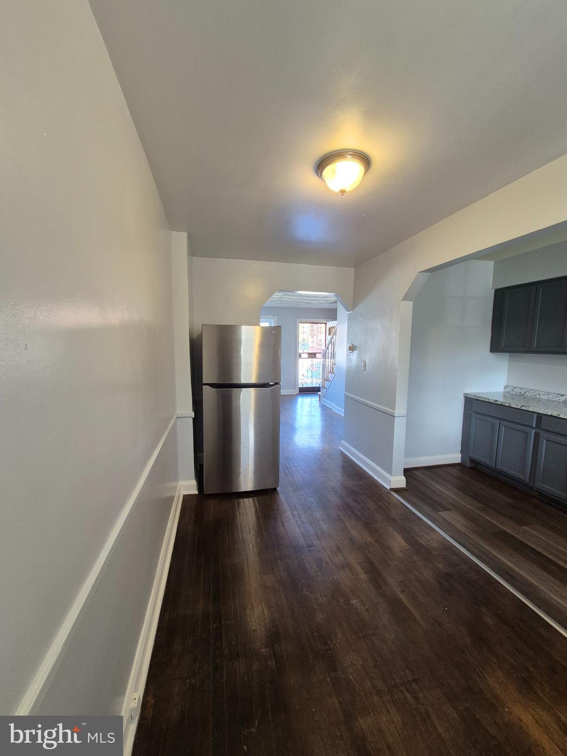 2863 Edgecombe Circle South Baltimore, MD 21215 - Photo 8 of 31 a kitchen with a refrigerator and a stove
