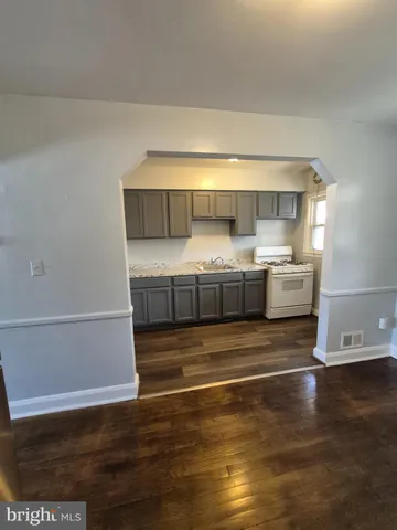 a view of kitchen and wooden floor