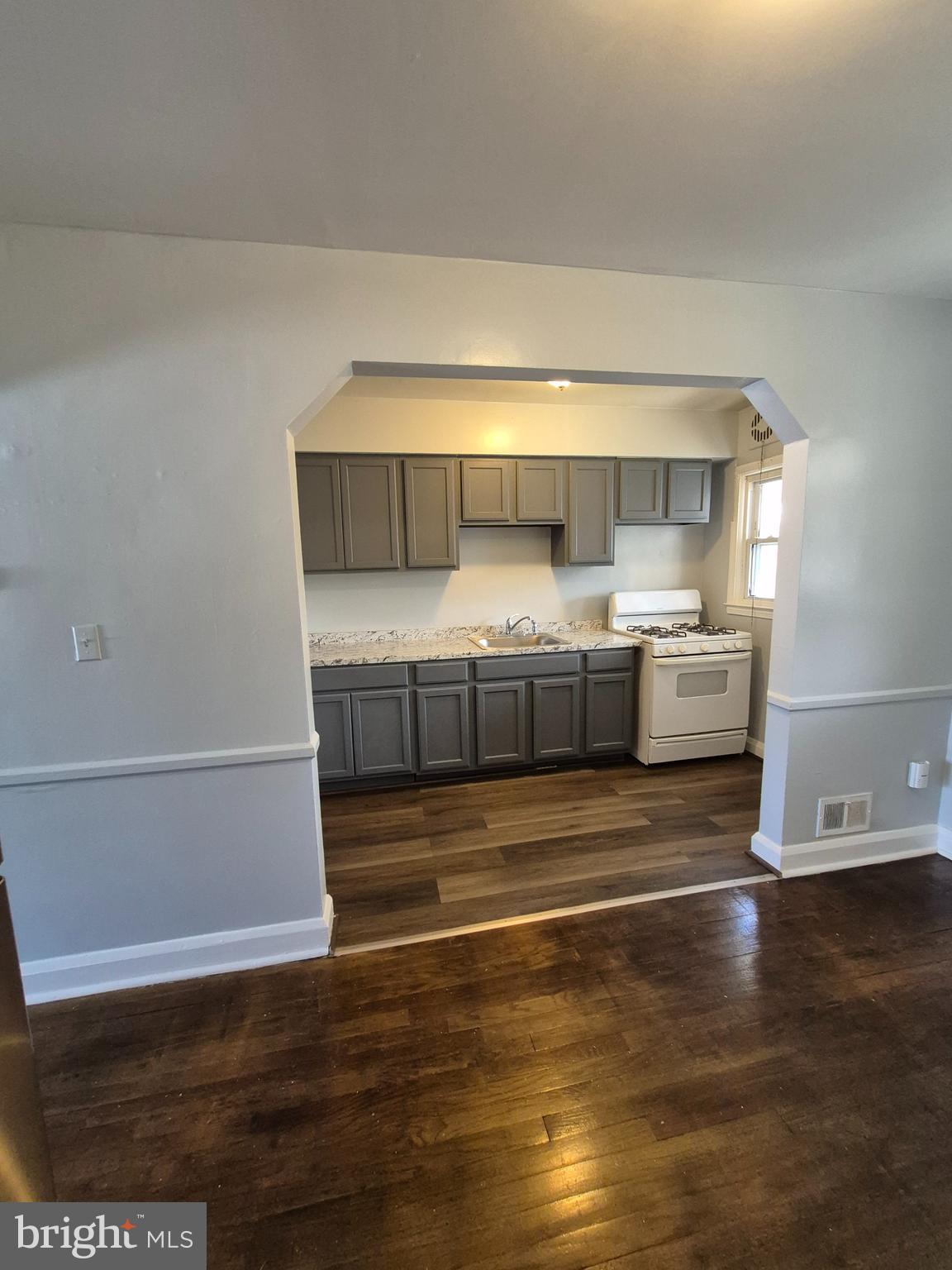 2863 Edgecombe Circle South Baltimore, MD 21215 - Photo 9 of 31 a view of kitchen and wooden floor