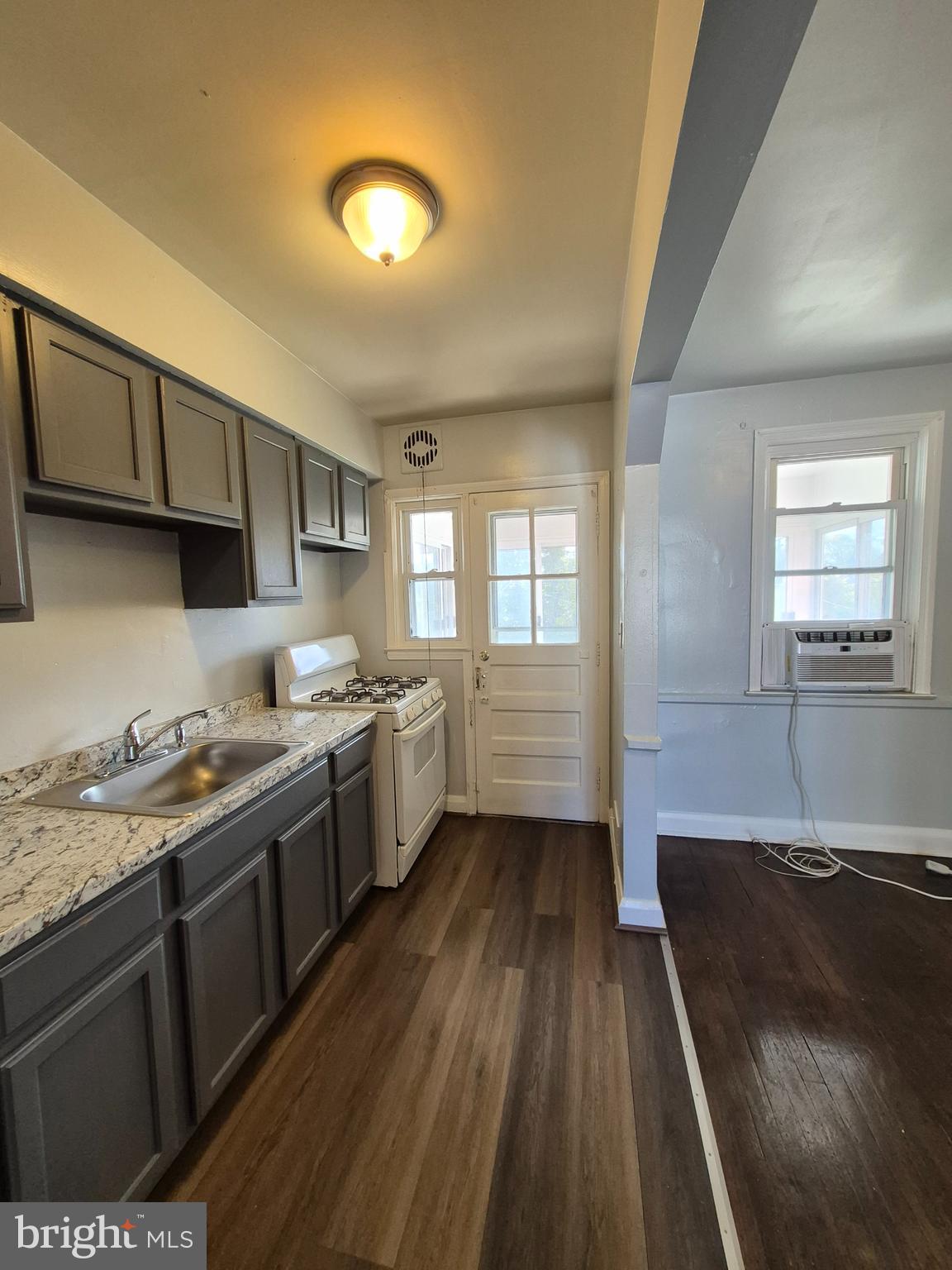 2863 Edgecombe Circle South Baltimore, MD 21215 - Photo 10 of 31 a kitchen with a sink and wooden floor