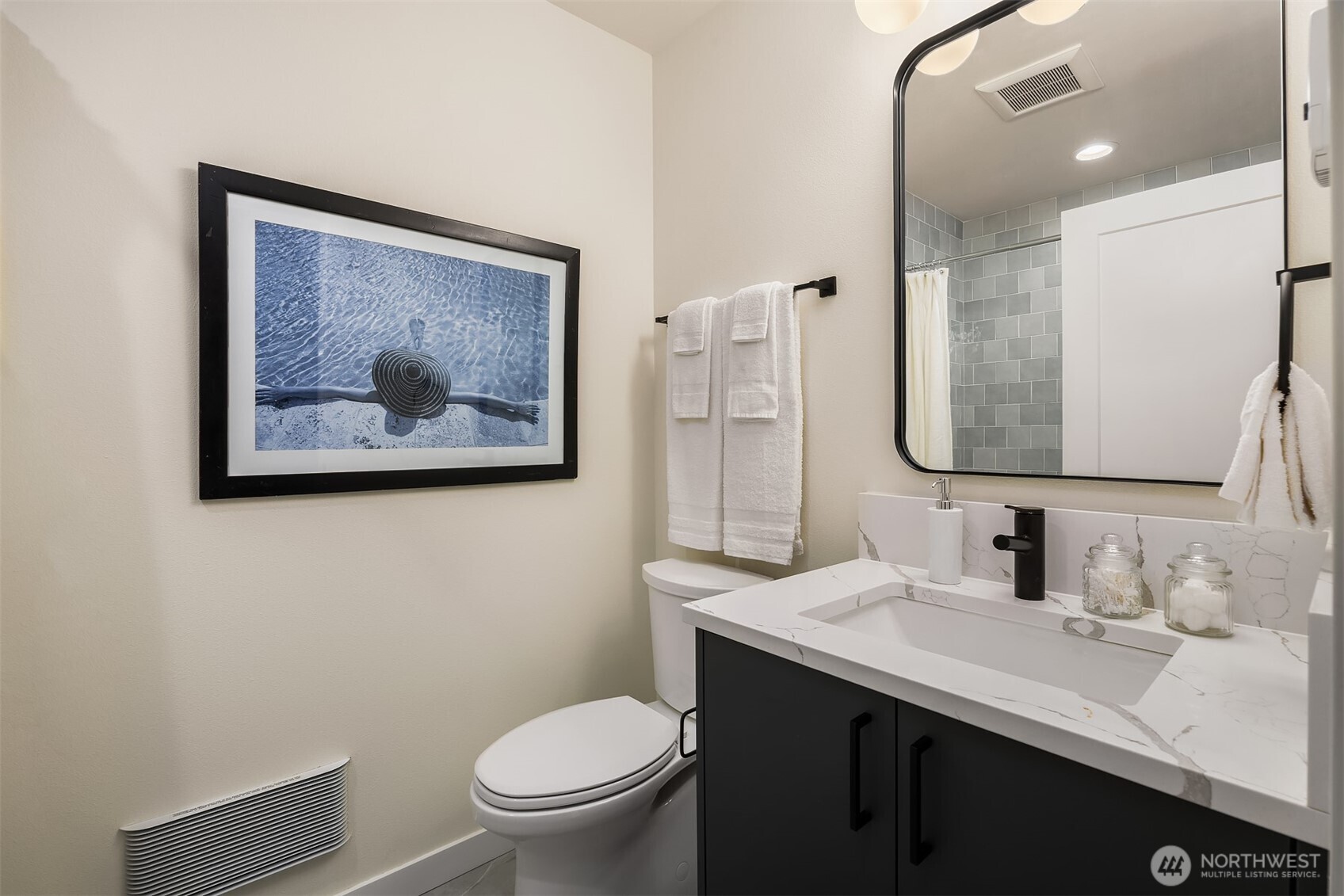 2314 B Fairview Avenue East Seattle, WA 98102 - Photo 15 of 32 a bathroom with a toilet a sink and a mirror