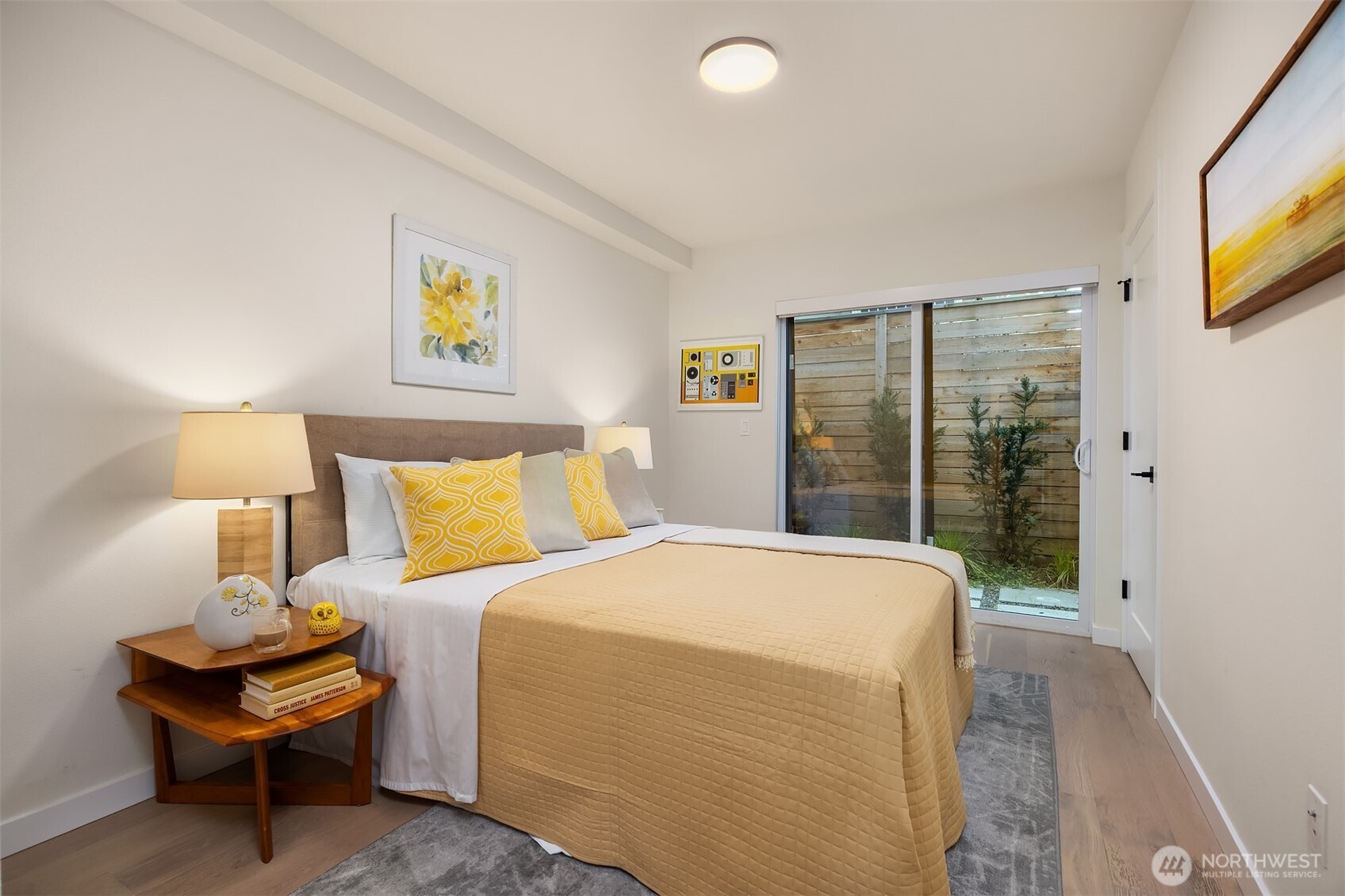 2314 B Fairview Avenue East Seattle, WA 98102 - Photo 17 of 32 a bedroom with a bed and a night stand