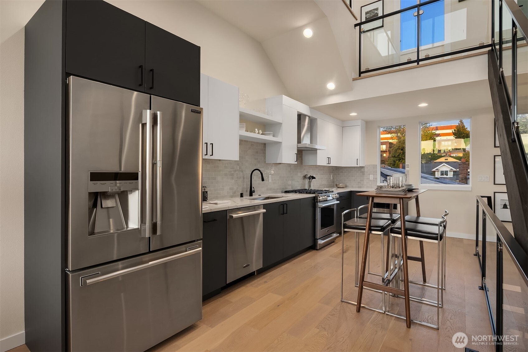 2314 B Fairview Avenue East Seattle, WA 98102 - Photo 5 of 32 a kitchen with stainless steel appliances granite countertop a refrigerator and a stove top oven