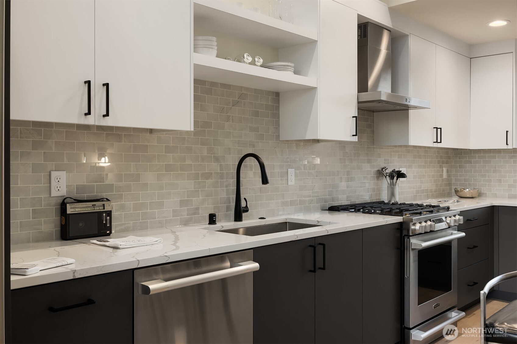 2314 B Fairview Avenue East Seattle, WA 98102 - Photo 6 of 32 a kitchen with stainless steel appliances granite countertop a sink stove and cabinets