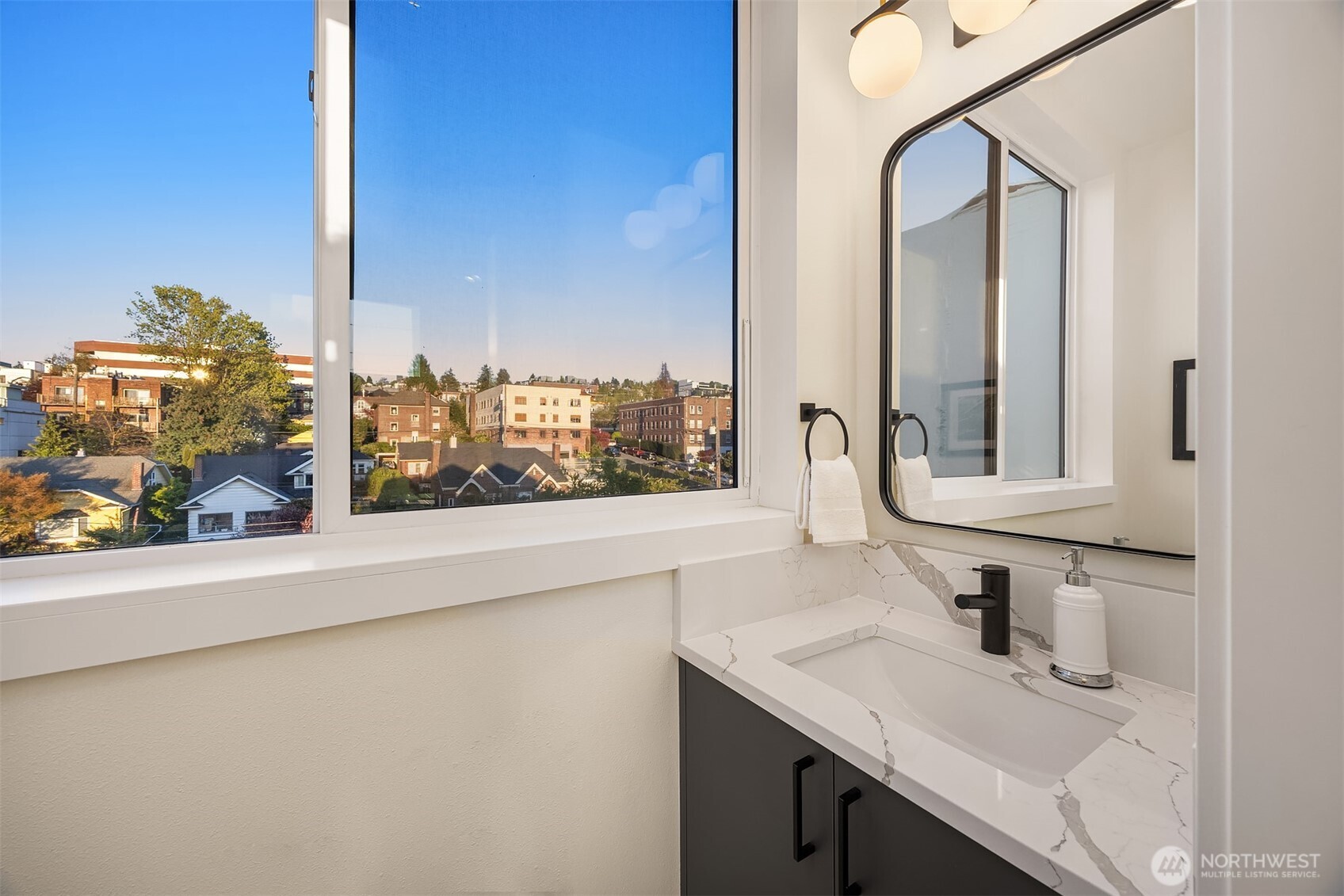 2314 B Fairview Avenue East Seattle, WA 98102 - Photo 10 of 32 a bathroom with a sink and a mirror