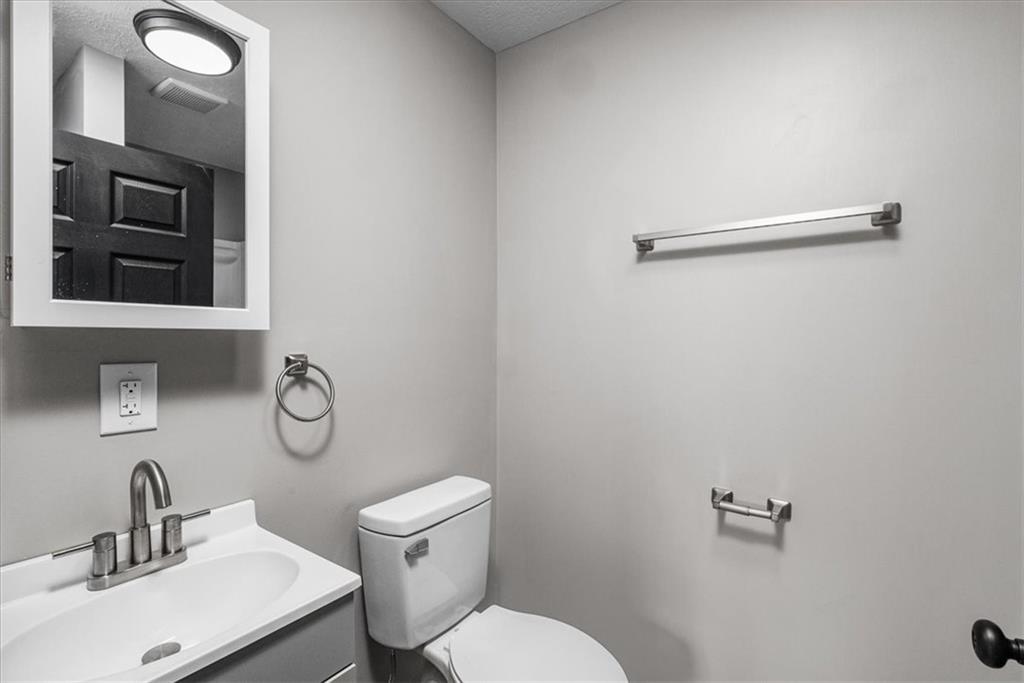 300 3rd Street Langeloth, PA 15054 - Photo 21 of 38 a bathroom with a toilet a sink and mirror