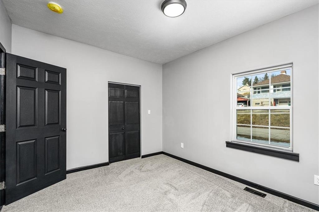 300 3rd Street Langeloth, PA 15054 - Photo 23 of 38 an empty room with windows
