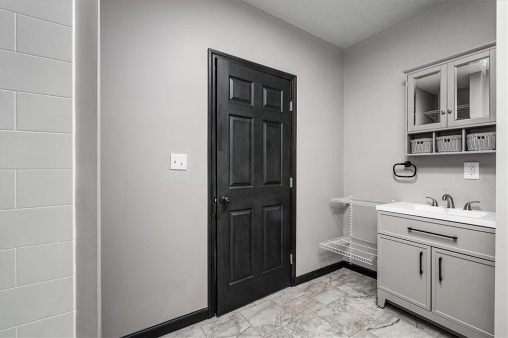 300 3rd Street Langeloth, PA 15054 - Photo 25 of 38 a bathroom with a toilet sink and a mirror