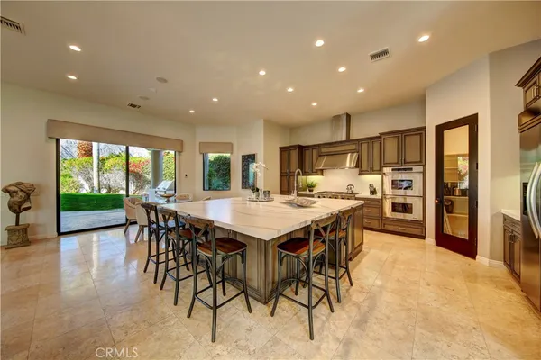 a kitchen with a table and chairs in it