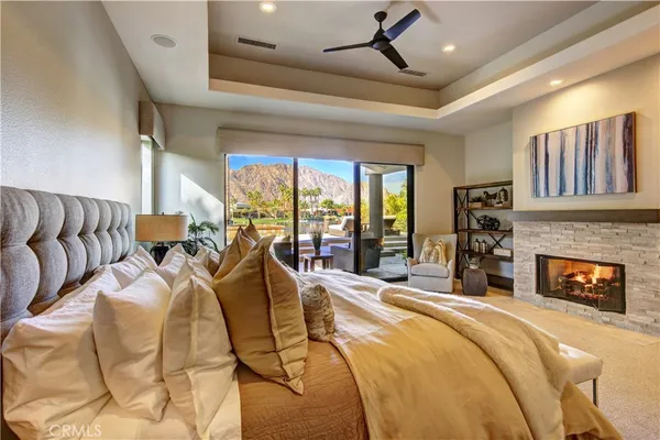 a bed room with a bed and a fireplace