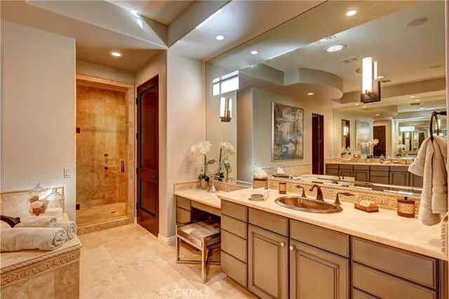 a spacious bathroom with a double vanity sink a mirror and a shower