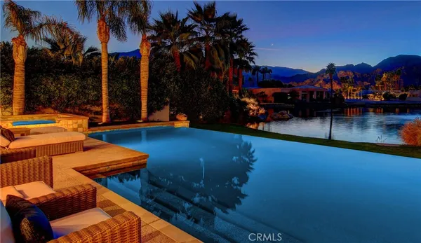 a view of a swimming pool with a lounge chairs