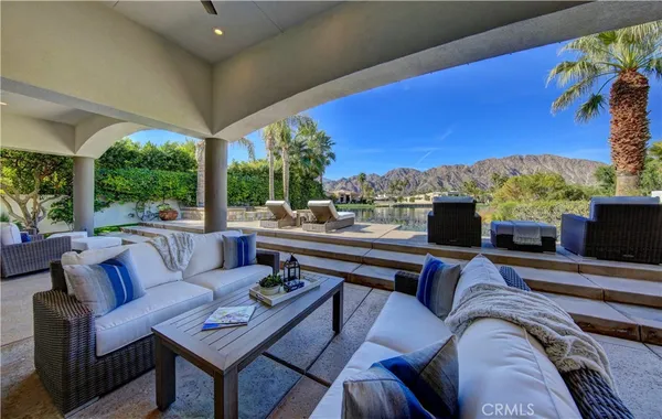 a outdoor living space with furniture and a potted plant