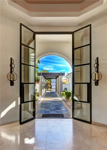 a living room with a door and a table