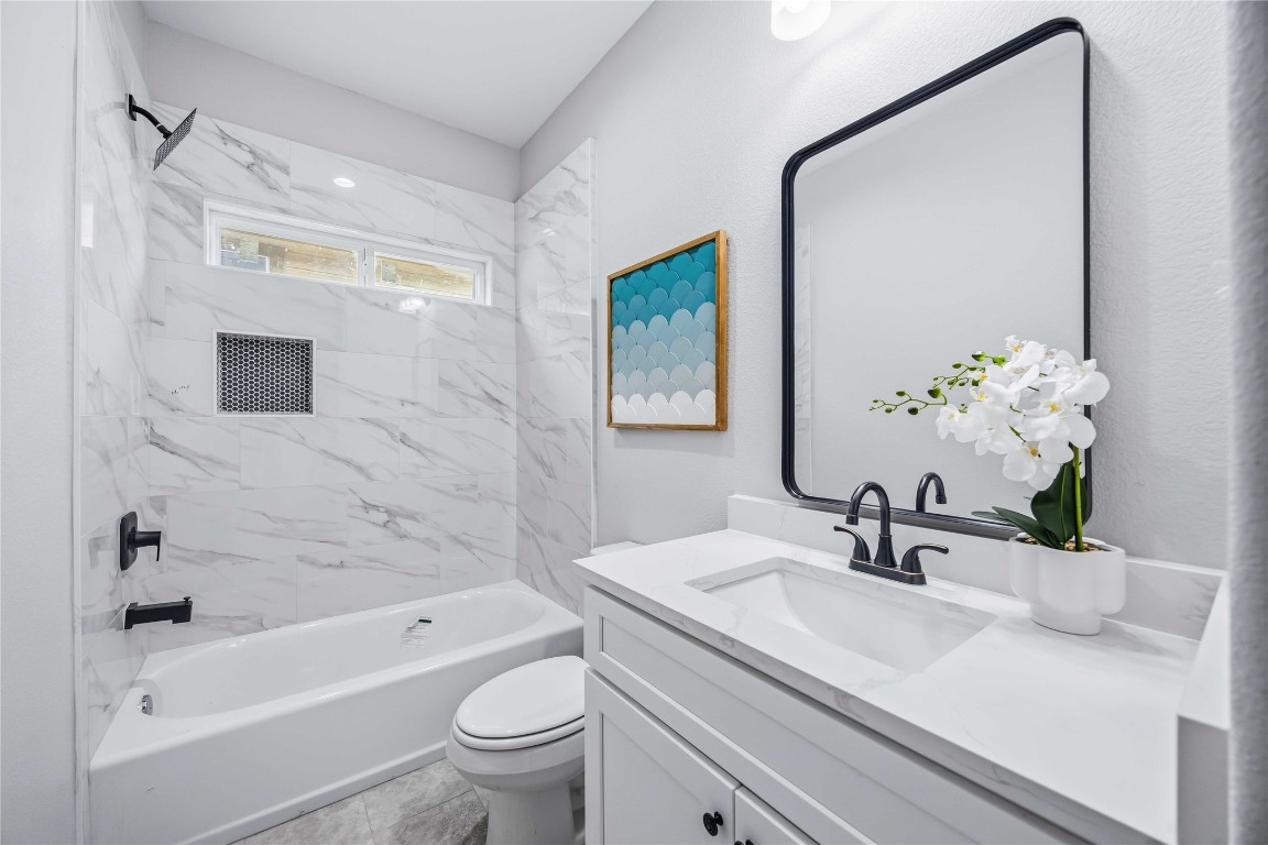 7316 Victoria Street Houston, TX 77020 - Photo 15 of 21 a bathroom with a sink a toilet and shower