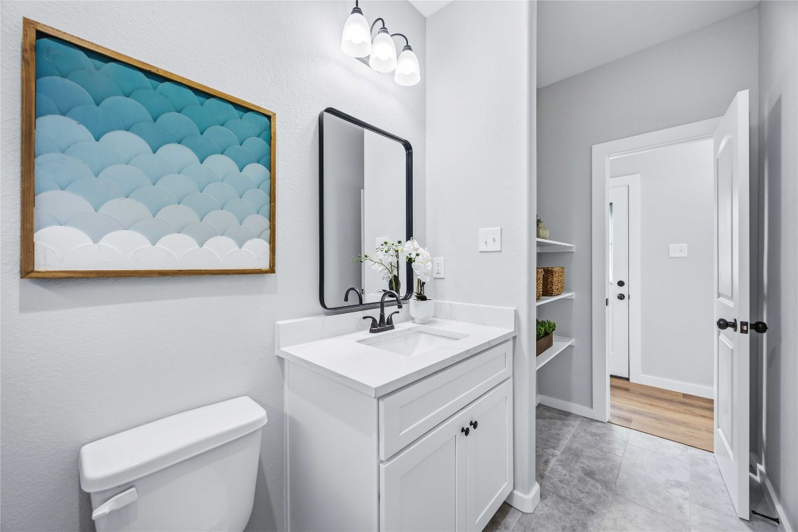 7316 Victoria Street Houston, TX 77020 - Photo 16 of 21 a bathroom with a toilet sink and mirror