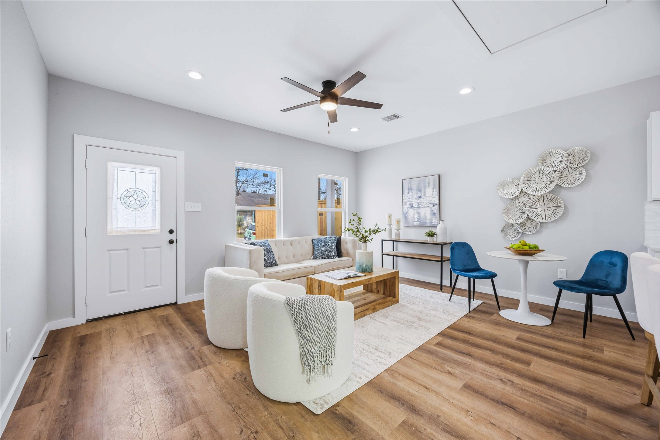 7316 Victoria Street Houston, TX 77020 - Photo 3 of 21 Living room and Kitchen is complemented by wood flooring and recessed lighting.