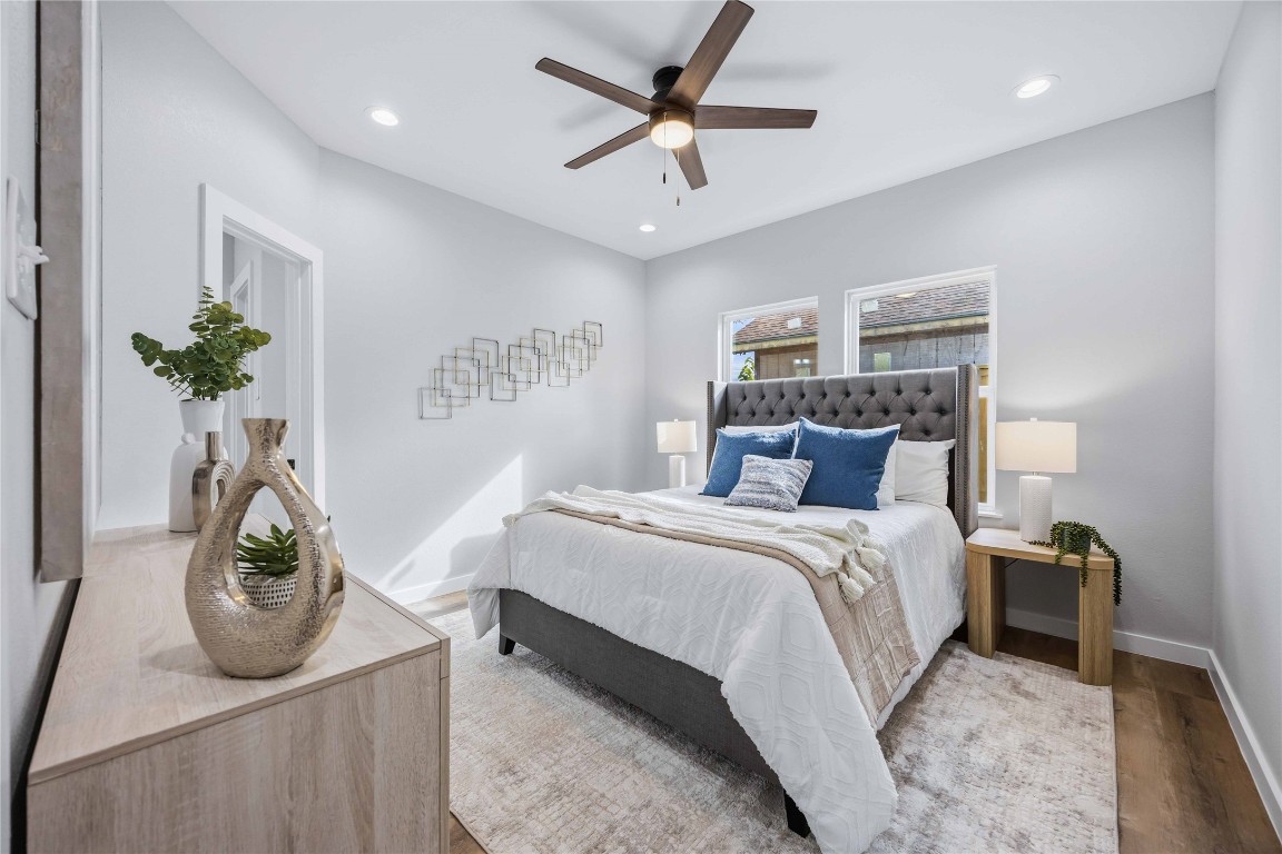 7316 Victoria Street Houston, TX 77020 - Photo 9 of 21 a bed room with a bed and a potted plant