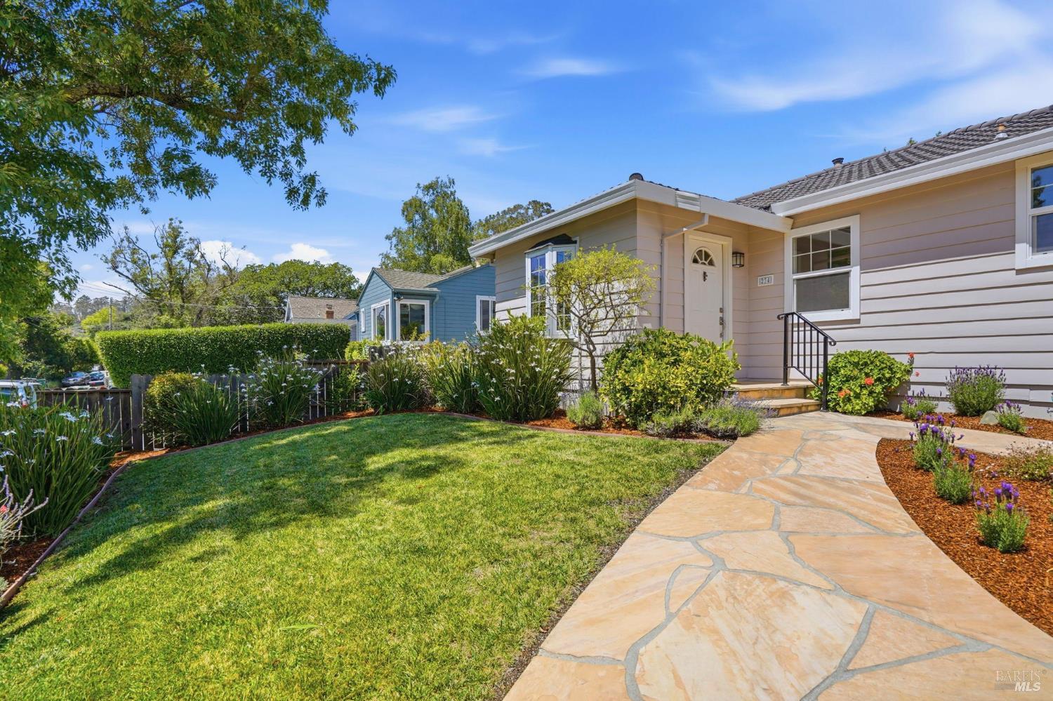 234 Solano Street San Rafael, CA 94901 - Photo 3 of 24 a front view of a house with a yard and potted plants