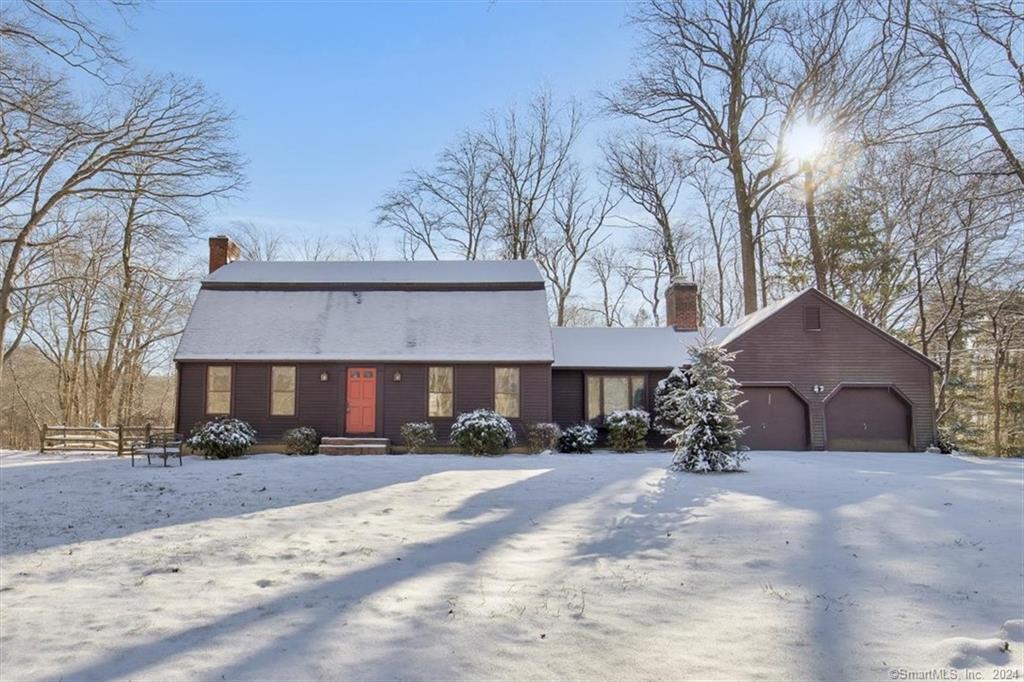1 Dwayne Road Old Saybrook, CT 06475 - Photo 1 of 1 a view of a house with a yard covered in snow