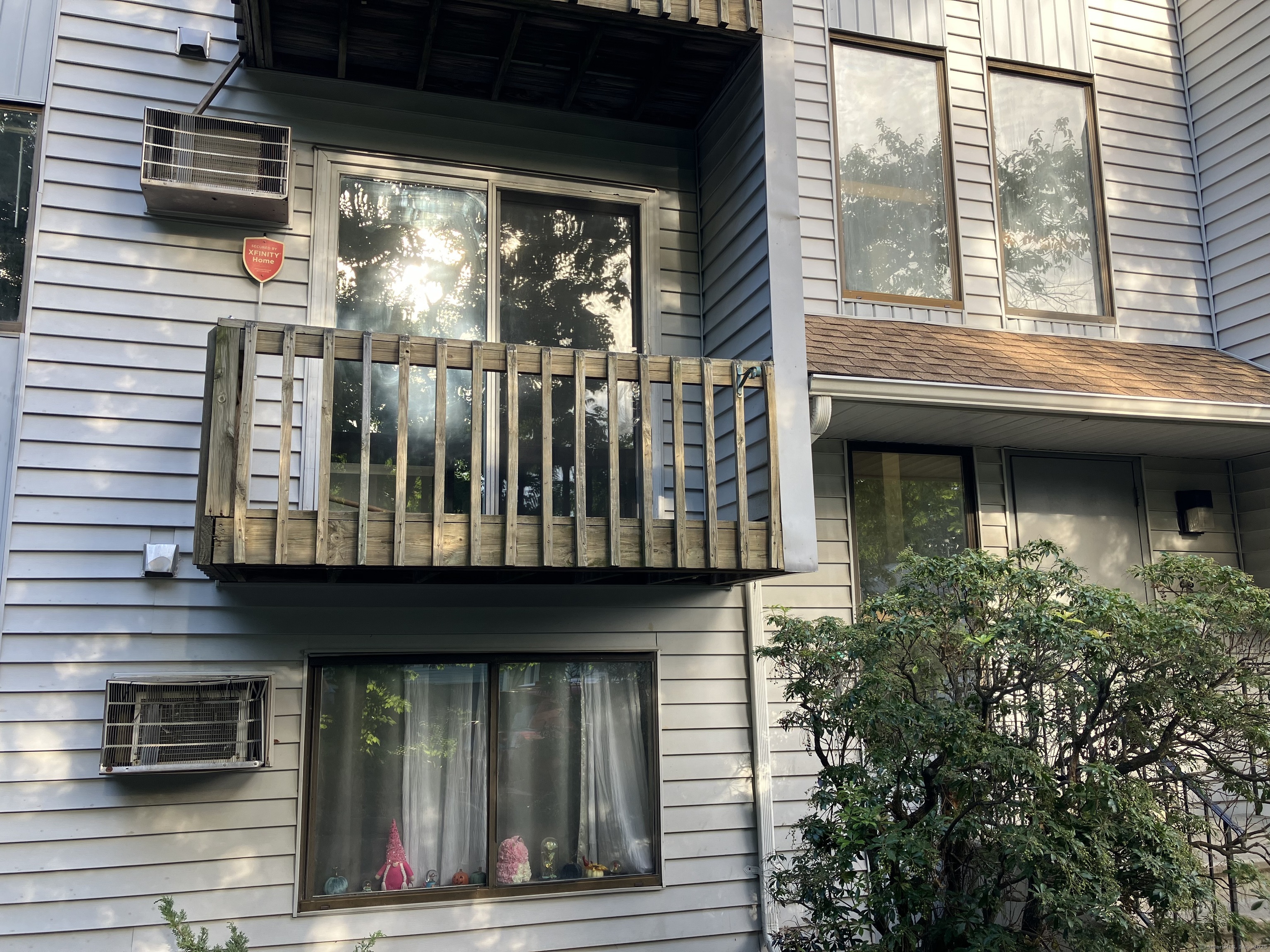 a view of brick house with large windows and a large window