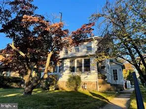 a view of house with yard