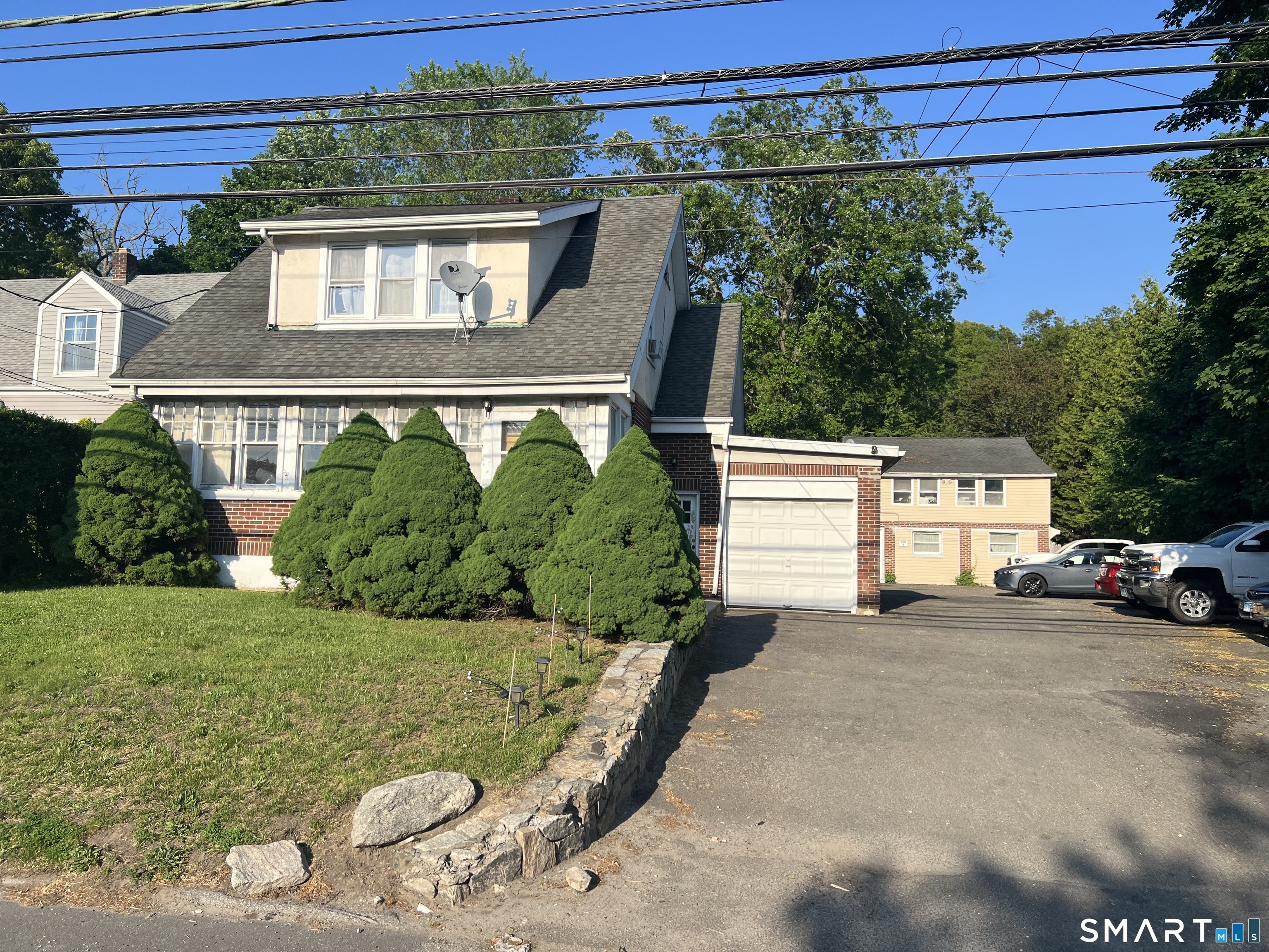 275 Long Ridge Road Stamford, CT 06905 - Photo 1 of 40 a front view of a house with garden