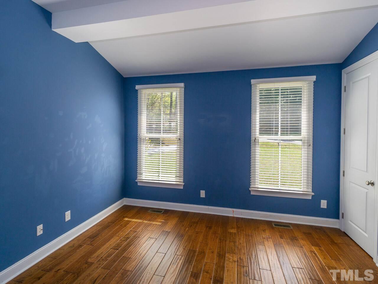 7992 Country Knoll Road Bahama, NC 27503 - Photo 22 of 30 a view of a room with wooden floor and windows