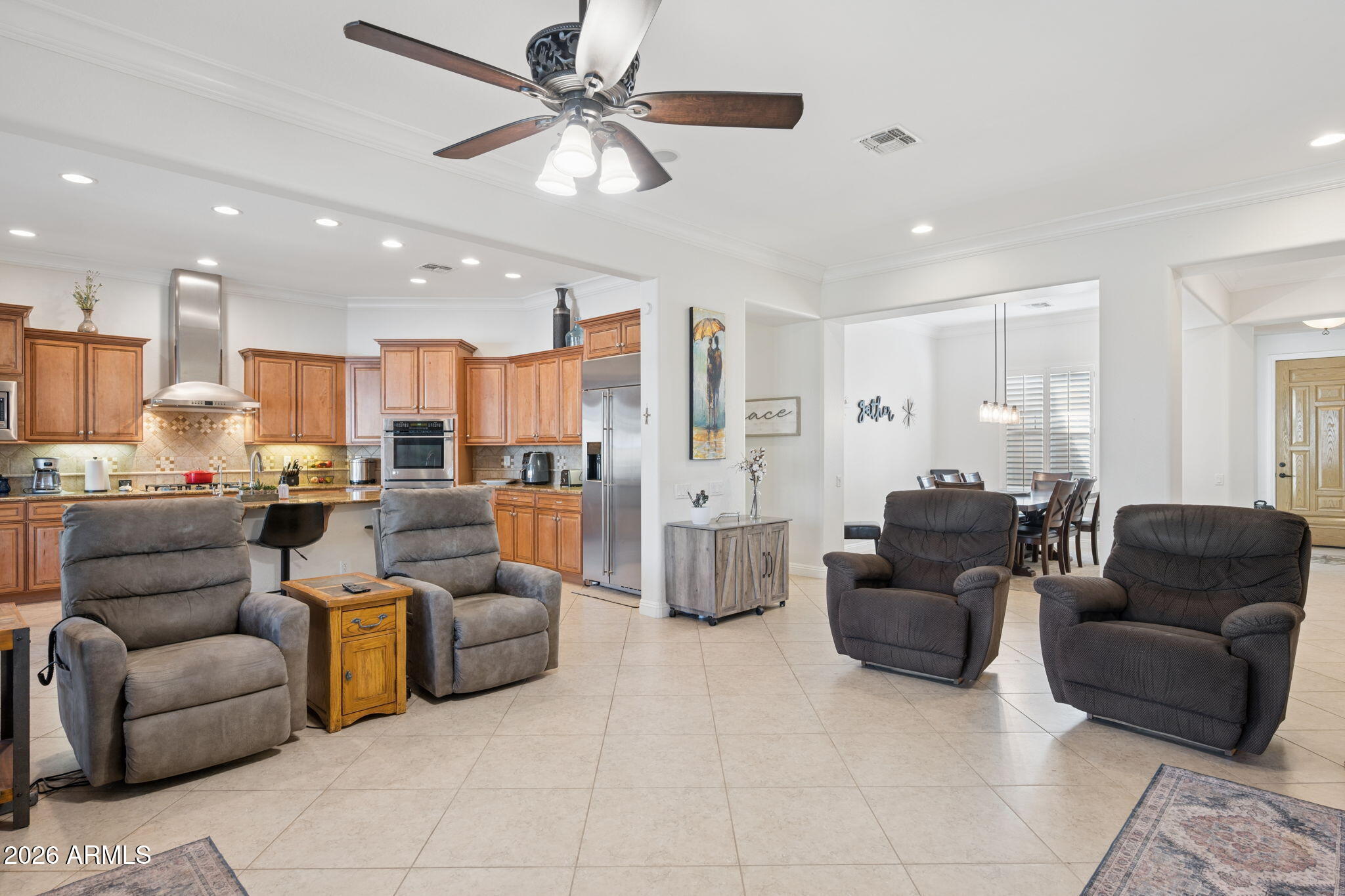 5508 West Parsons Road Phoenix, AZ 85083 - Photo 14 of 48 a living room with furniture kitchen view and a chandelier