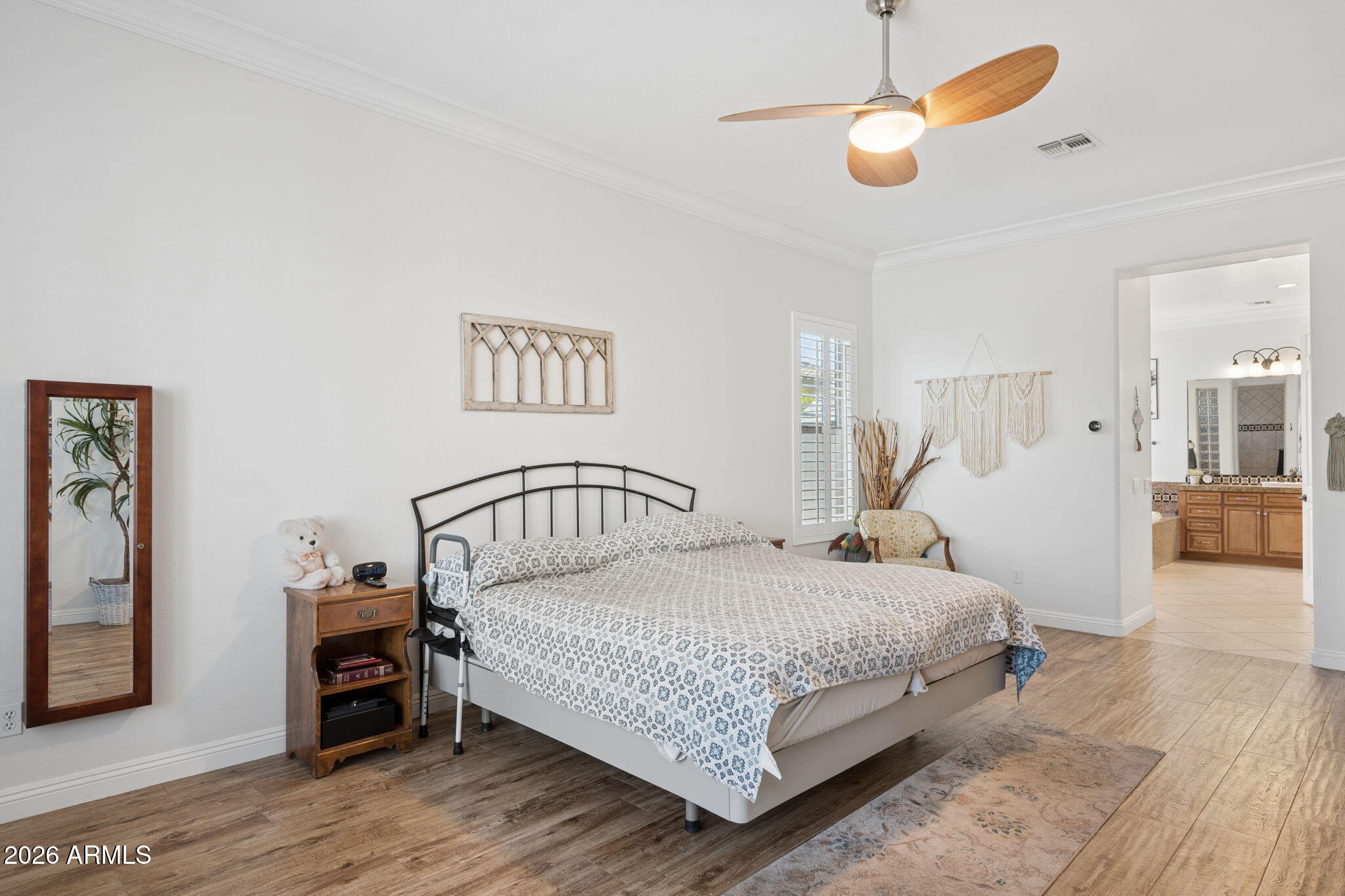 5508 West Parsons Road Phoenix, AZ 85083 - Photo 21 of 48 a bedroom with a bed and a chandelier