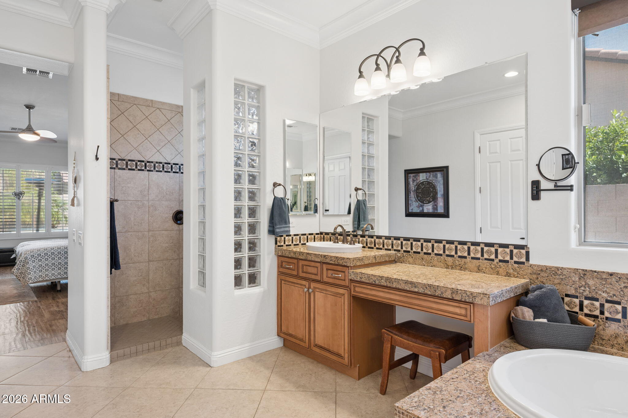 5508 West Parsons Road Phoenix, AZ 85083 - Photo 25 of 48 a bathroom with a tub a sink and a mirror