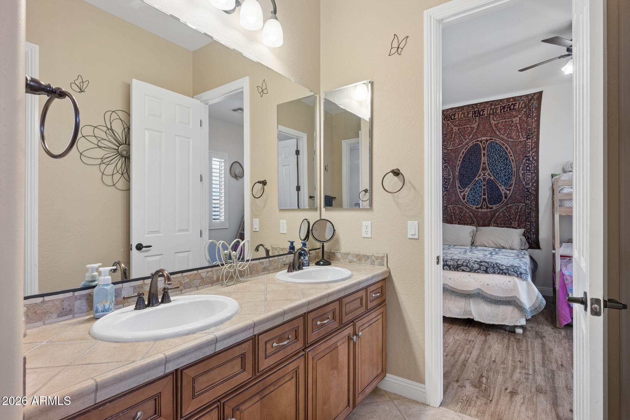 5508 West Parsons Road Phoenix, AZ 85083 - Photo 28 of 48 a en suite bathroom with a granite countertop sink and a mirror
