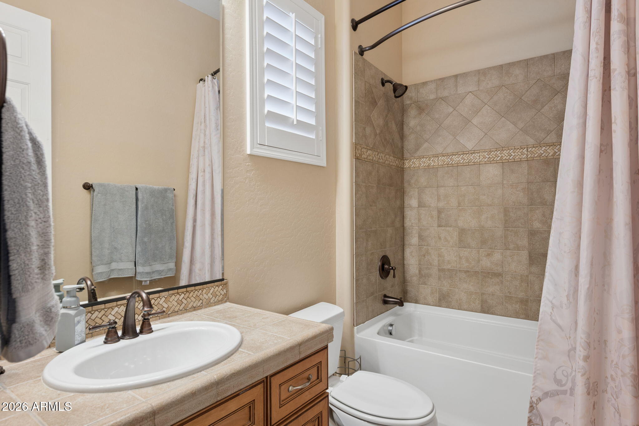 5508 West Parsons Road Phoenix, AZ 85083 - Photo 34 of 48 a bathroom with a granite countertop sink toilet and shower