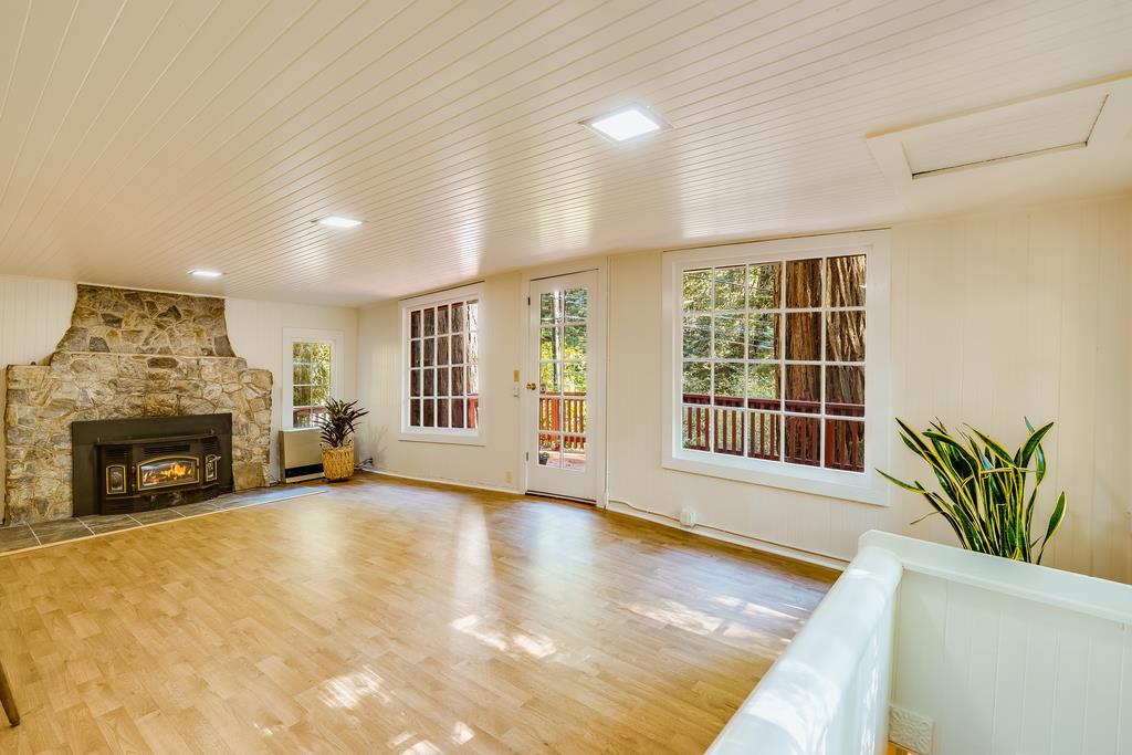 2001 Cathedral Drive Aptos, CA 95003 - Photo 15 of 42 a view of an empty room with a fireplace and a window