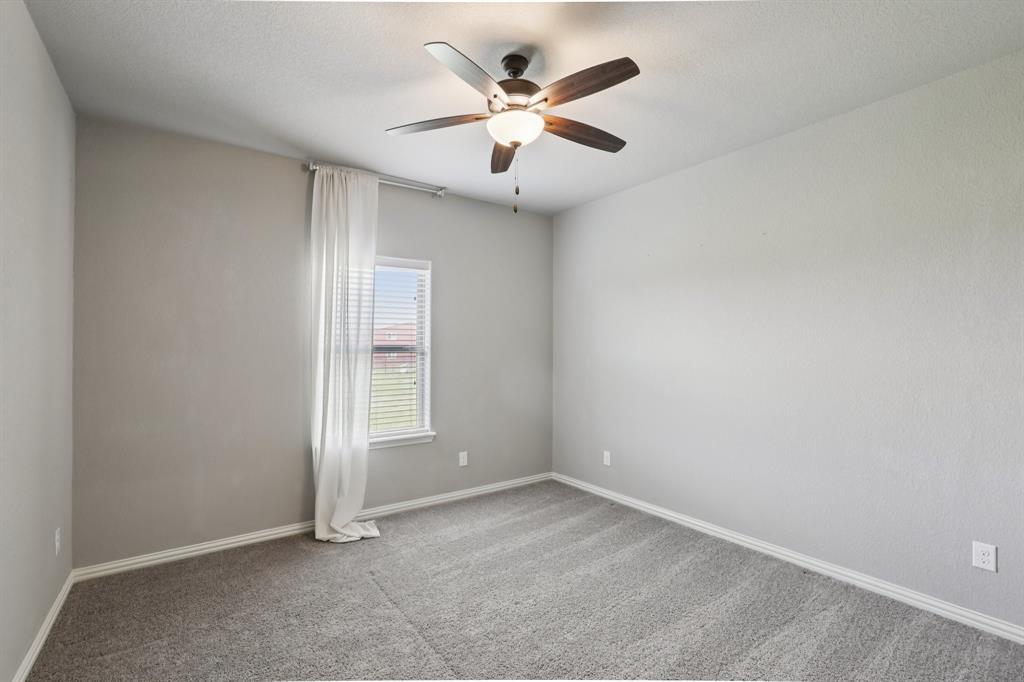 1020 Jesse James Lane Springtown, TX 76082 - Photo 19 of 38 an empty room with closet and ceiling fan