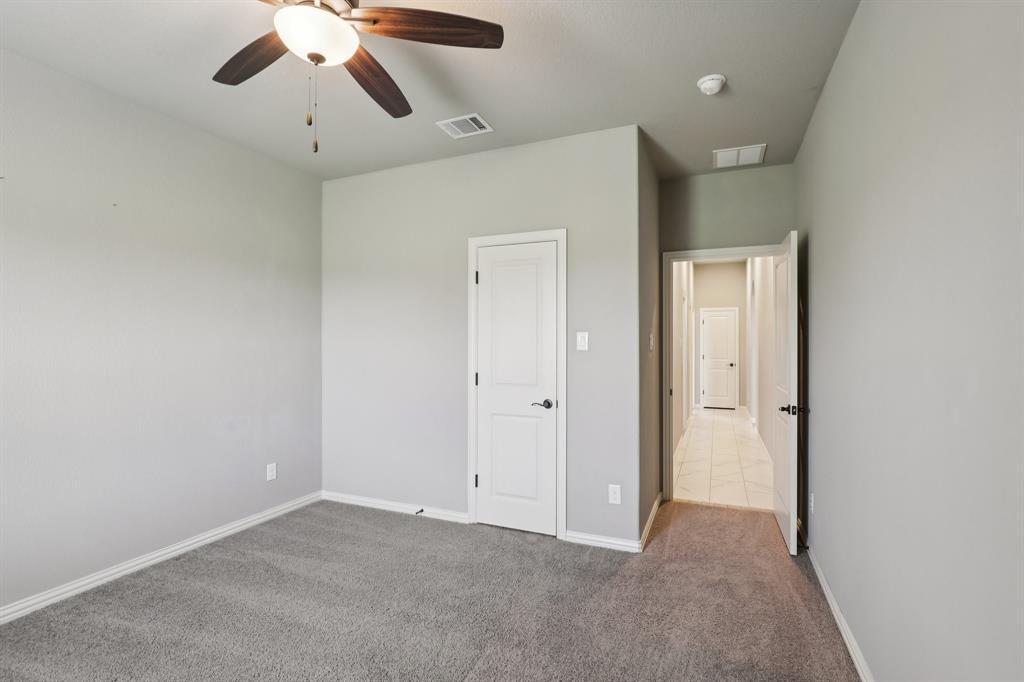 1020 Jesse James Lane Springtown, TX 76082 - Photo 20 of 38 an empty room with chandelier fan