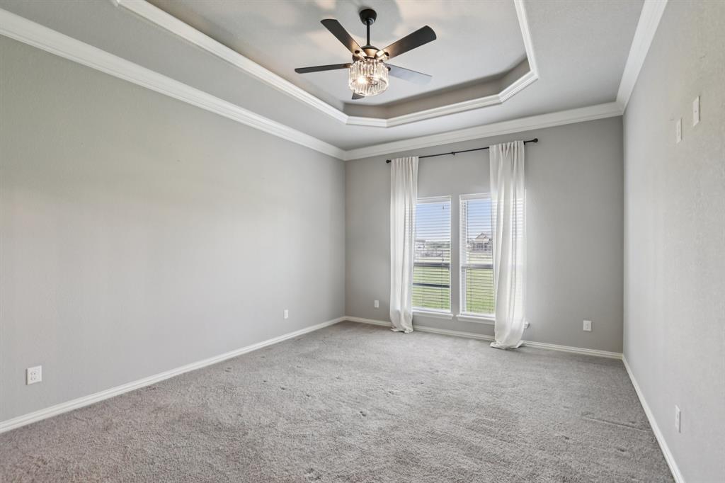 1020 Jesse James Lane Springtown, TX 76082 - Photo 24 of 38 an empty room with fan and windows