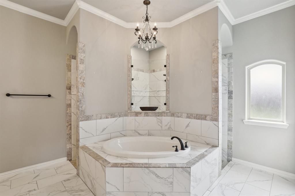 1020 Jesse James Lane Springtown, TX 76082 - Photo 28 of 38 a bathroom with a bathtub and shower