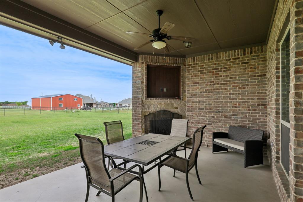 1020 Jesse James Lane Springtown, TX 76082 - Photo 32 of 38 a balcony with a table and chairs