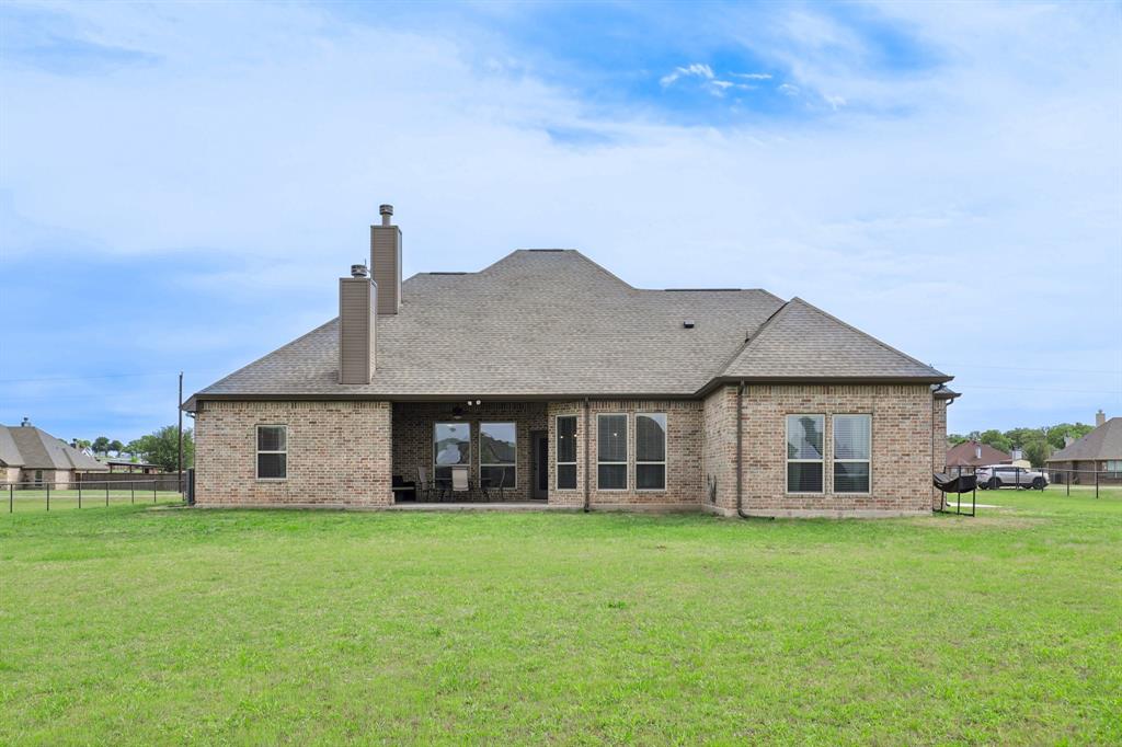 1020 Jesse James Lane Springtown, TX 76082 - Photo 34 of 38 front view of house with a yard