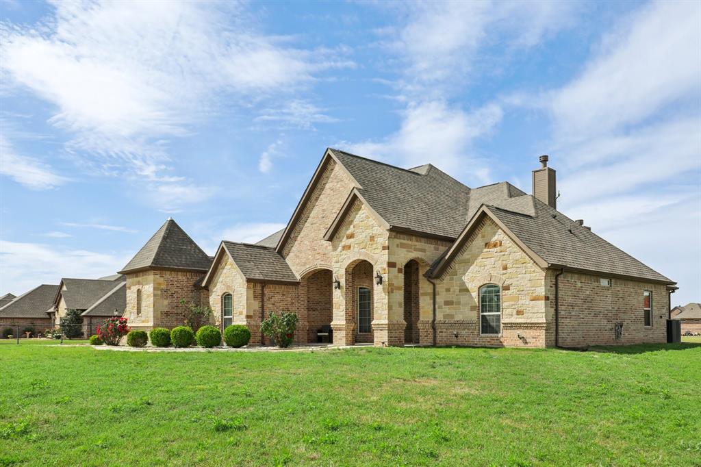 1020 Jesse James Lane Springtown, TX 76082 - Photo 5 of 38 a view of a house with a yard