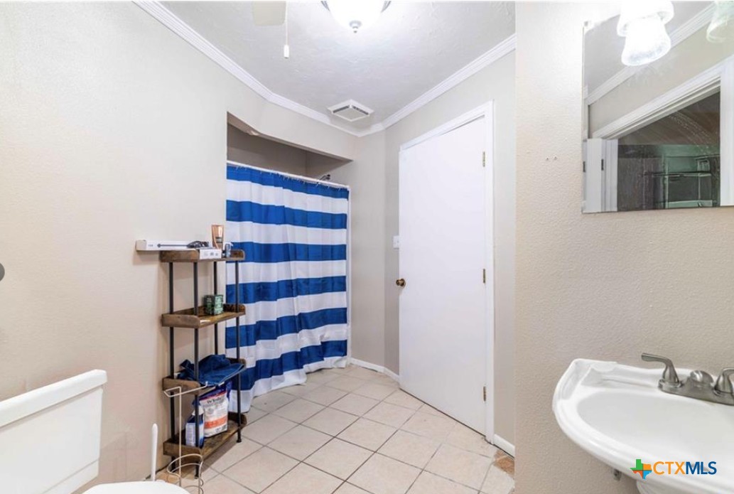 503 Rabbit Run Road Victoria, TX 77905 - Photo 17 of 20 a bathroom with a sink and a mirror