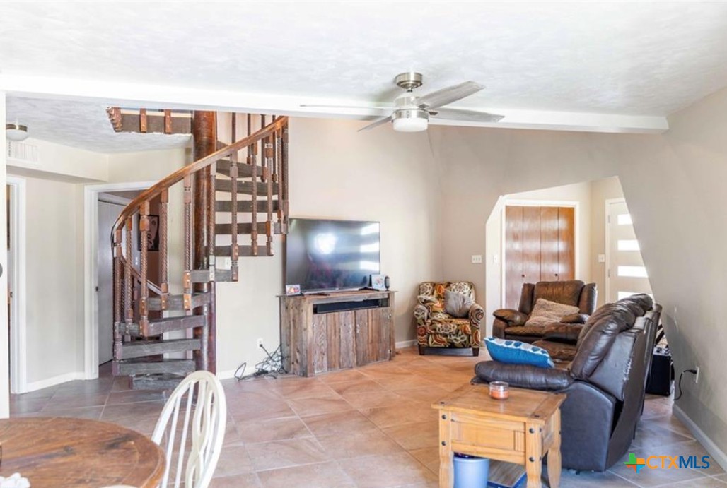 503 Rabbit Run Road Victoria, TX 77905 - Photo 18 of 20 a living room with furniture a dining table and chairs with wooden floor