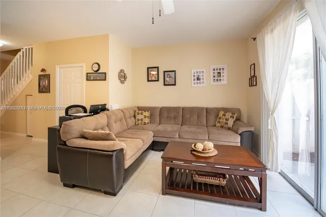 a living room with furniture and a couch